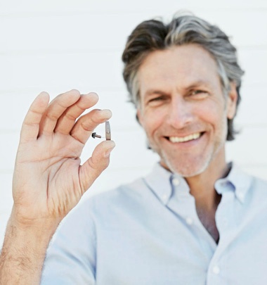 Man with Legend Hearing Aid Man with Legend Hearing Aid
