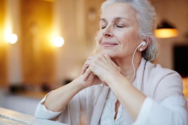 woman-listening-ear-buds